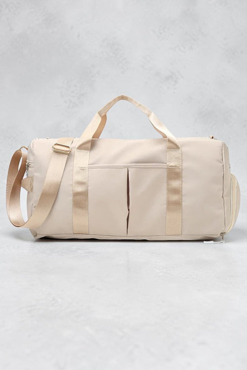 SOLID APPRL beige water-resistant nylon duffel bag with reinforced handles and adjustable shoulder strap for travel.