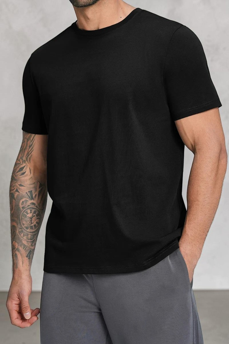 SOLID APPRL black crew neck short sleeve t-shirt on a tattooed man, featuring a soft-touch, breathable fabric.