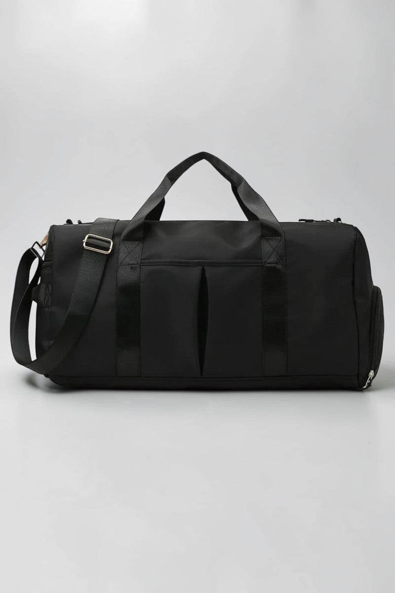 SOLID APPRL black water-resistant nylon duffel bag with reinforced handles and adjustable shoulder strap for travel.