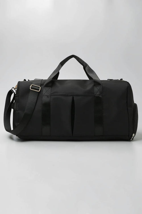 SOLID APPRL black water-resistant nylon duffel bag with reinforced handles and adjustable shoulder strap for travel.