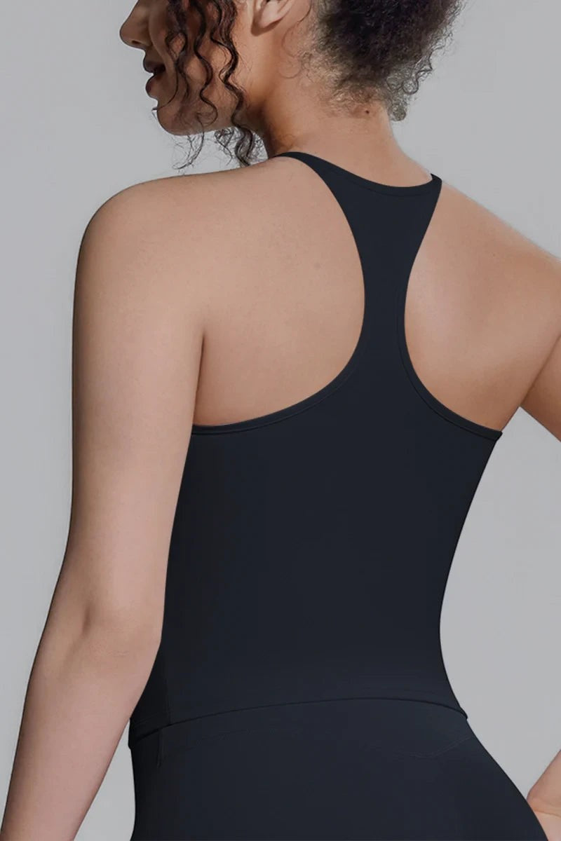 SOLID APPRL black moisture-wicking racerback tank top worn by a woman, featuring a fitted athletic design.