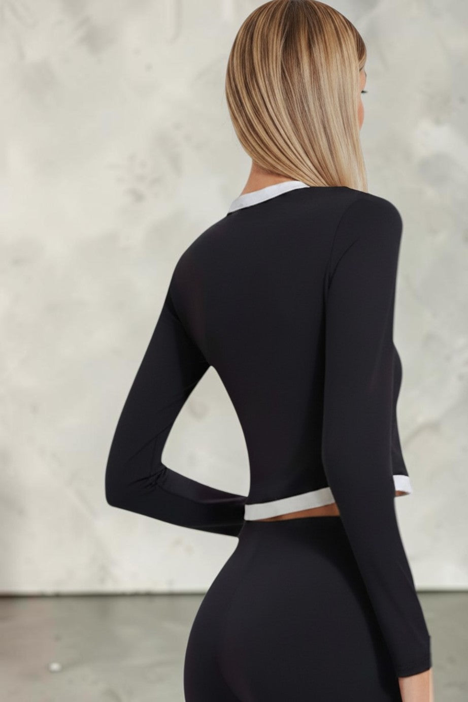 SOLID APPRL black and white long sleeve button-up crop top with contrast trim worn by a blonde model.