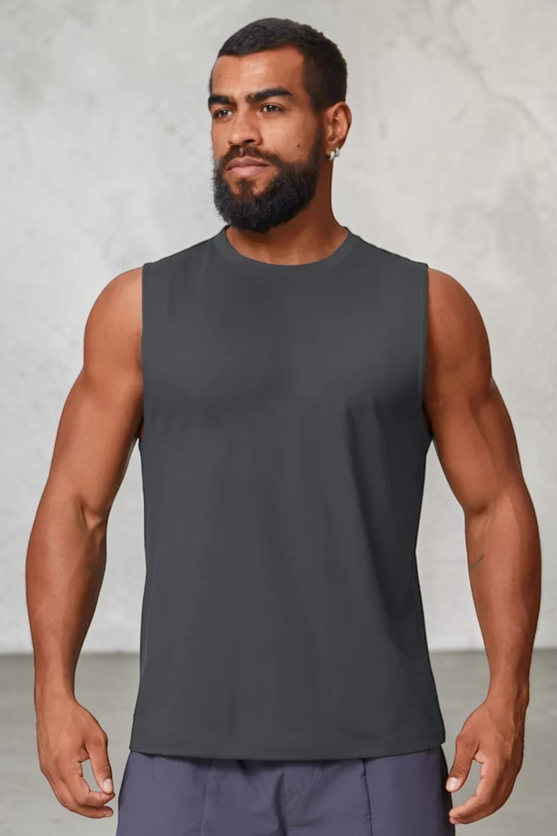 A man wearing a charcoal grey SOLID APPRL performance sleeveless tank top with a crew neck for gym workouts.