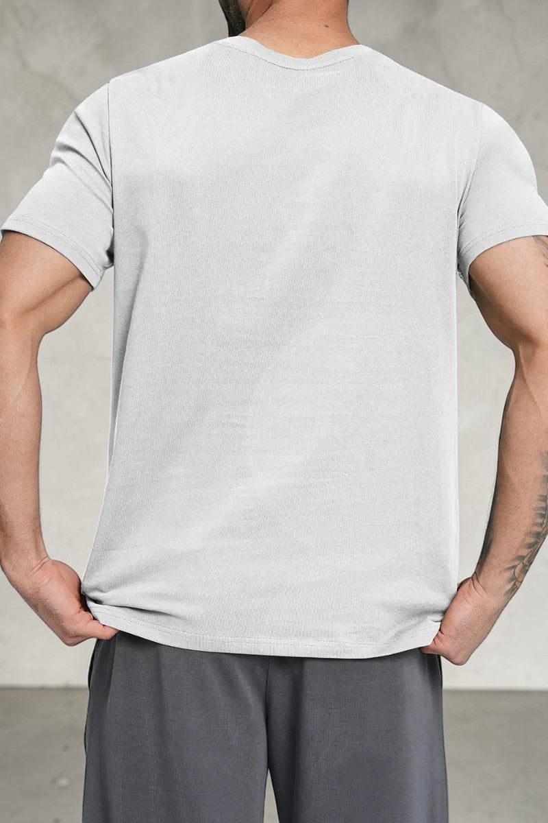 SOLID APPRL men's light grey crew neck short sleeve t-shirt with a classic fit on a muscular model
