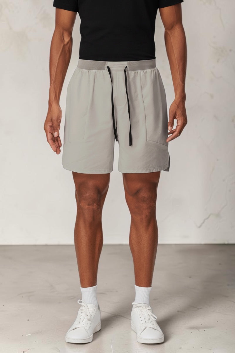 SOLID APPRL light grey performance athletic shorts with adjustable drawstring waistband and moisture-wicking fabric.