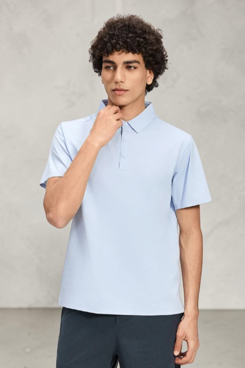 Model wearing a light blue SOLID APPRL short sleeve polo shirt with a structured collar and tailored fit.