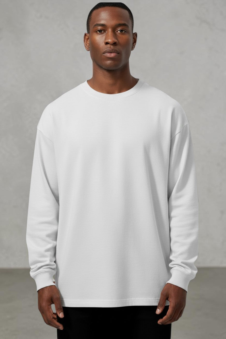 Model wearing a SOLID APPRL light grey long sleeve crewneck shirt with a relaxed fit and ribbed cuffs.