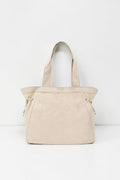 SOLID APPRL beige lightweight tote handbag with adjustable side cinches and comfortable shoulder straps.