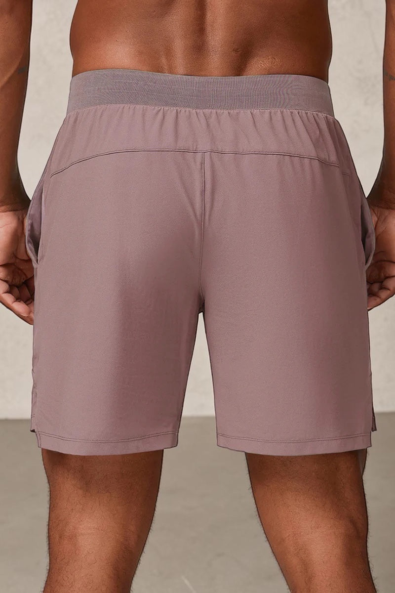 SOLID APPRL mauve performance athletic shorts with a comfortable elastic waistband and deep side pockets.