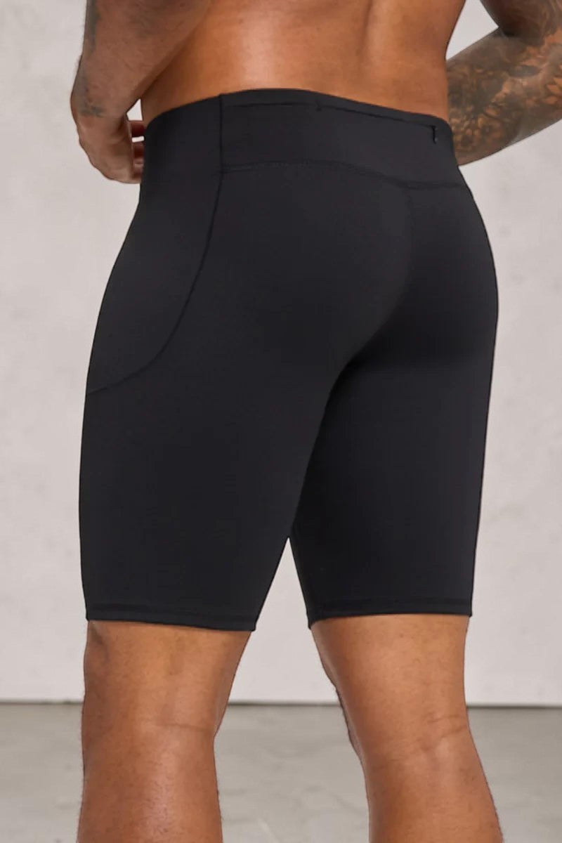 SOLID APPRL men's black compression training shorts with a high-rise waistband and side pockets for athletic support.