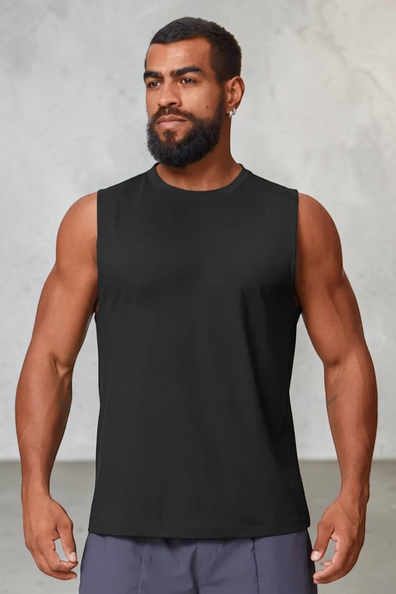 A man wearing a black SOLID APPRL performance tank top with a crew neckline, designed for gym workouts.