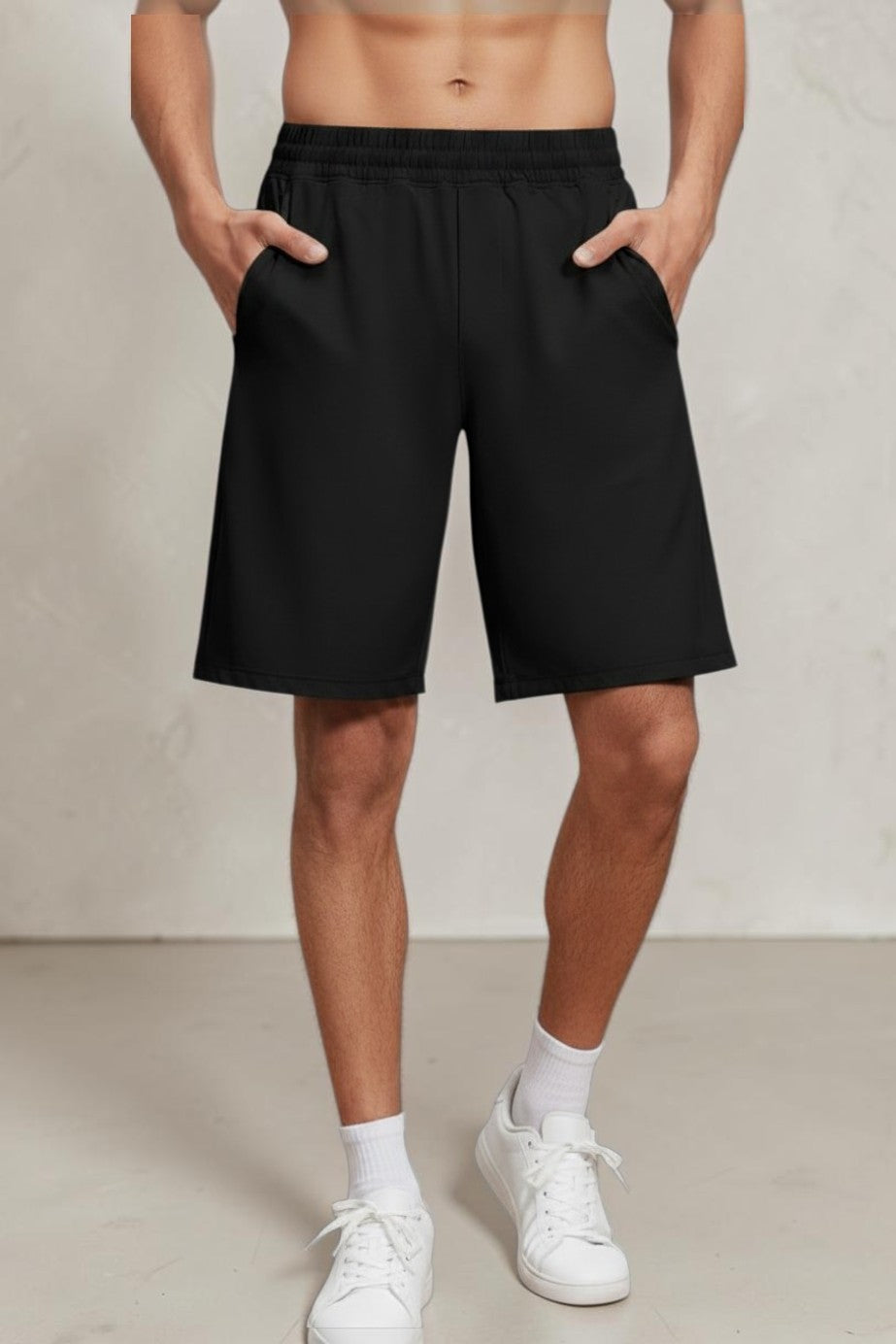 SOLID APPRL men's grey performance athletic training shorts with an elastic waistband and side pockets on a model.