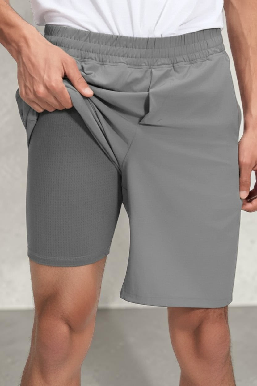 SOLID APPRL men's grey performance training shorts with built-in moisture-wicking compression liner and elastic waist.