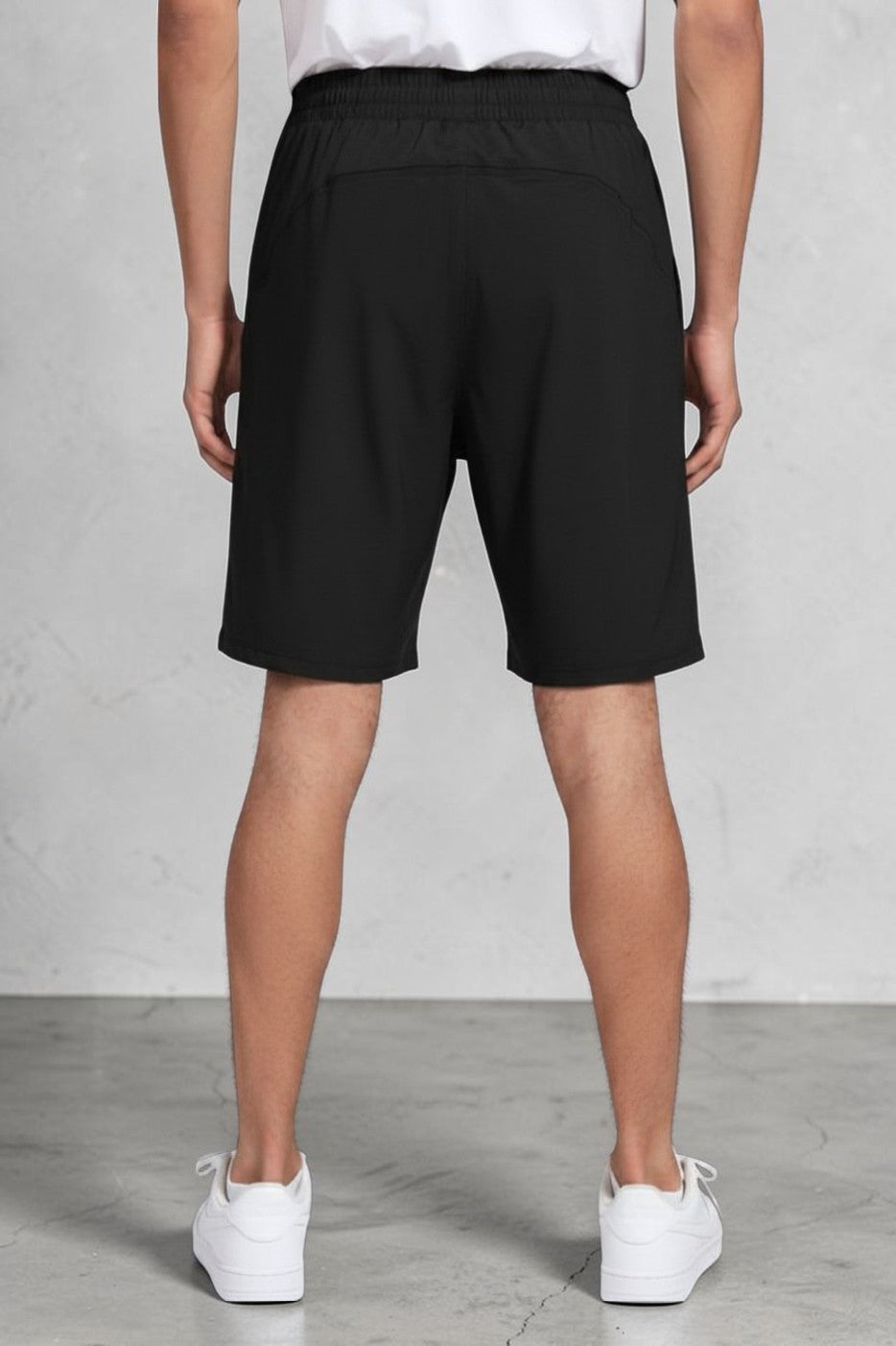Back view of SOLID APPRL men's grey performance training shorts with elastic waistband and breathable back panel.