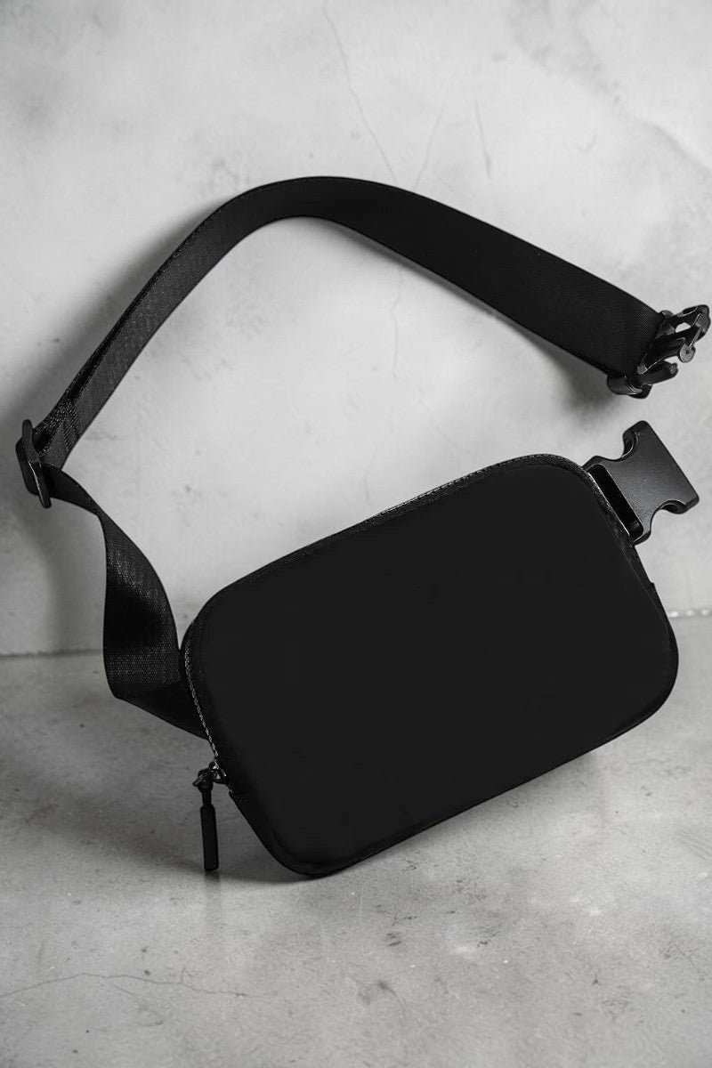 SOLID APPRL minimalist black waist bag with adjustable strap and secure zipper closure for everyday carry.