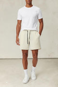 SOLID APPRL performance athletic shorts in cream with an adjustable drawstring waistband and deep side pockets.