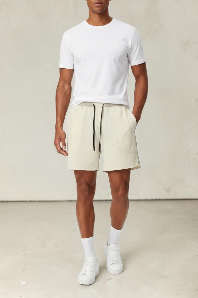 SOLID APPRL performance athletic shorts in cream with an adjustable drawstring waistband and deep side pockets.