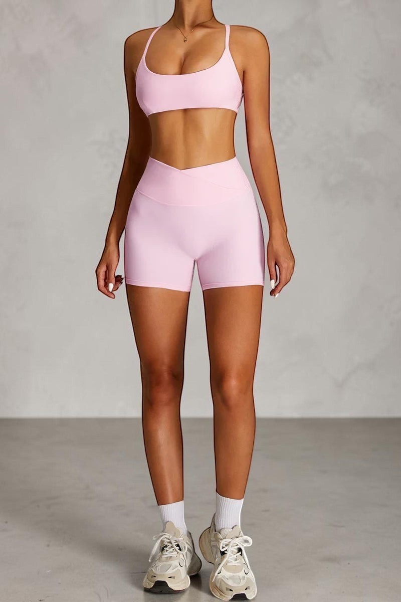 SOLID APPRL light pink athletic shorts with crossover waistband and matching sports bra