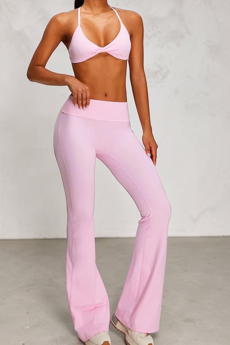 SOLID APPRL high-waisted pink flare yoga pants with seamless contouring for a flattering silhouette.