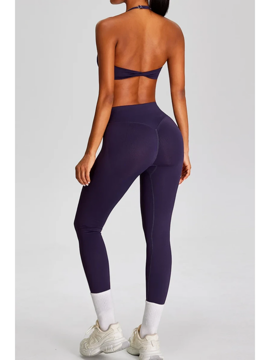 SOLID APPRL deep plum seamless high-waisted workout leggings with textured waistband and matching sports bra.