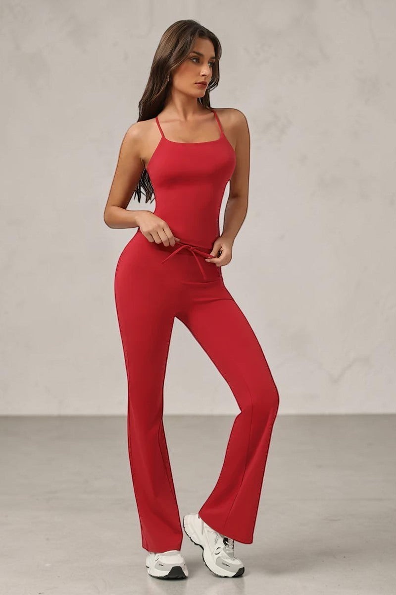 SOLID APPRL women's red athletic tank top and flare pants set with criss-cross straps and drawstring waist.