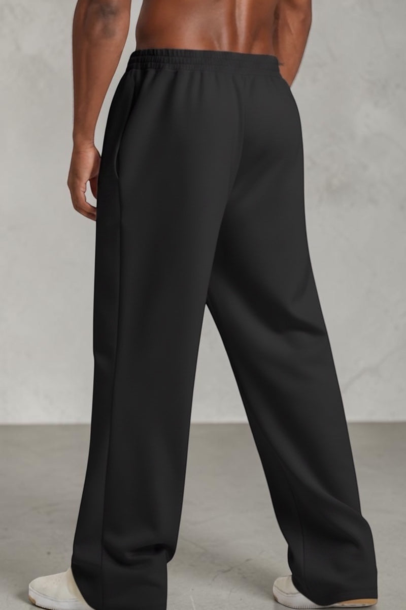 SOLID APPRL relaxed-fit cream sweatpants with an elastic waistband and straight-leg cut worn by a shirtless model.