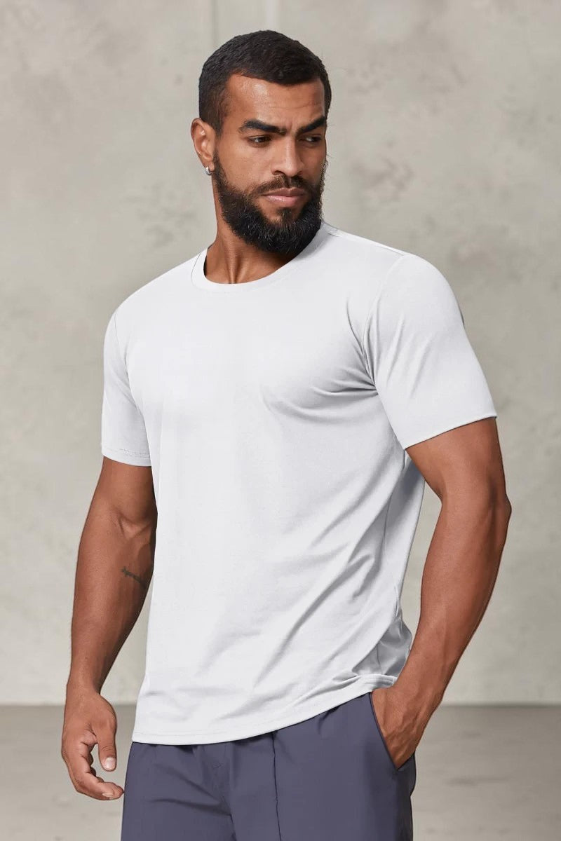 SOLID APPRL white performance crew neck t-shirt on a muscular model, featuring moisture-wicking athletic fabric.