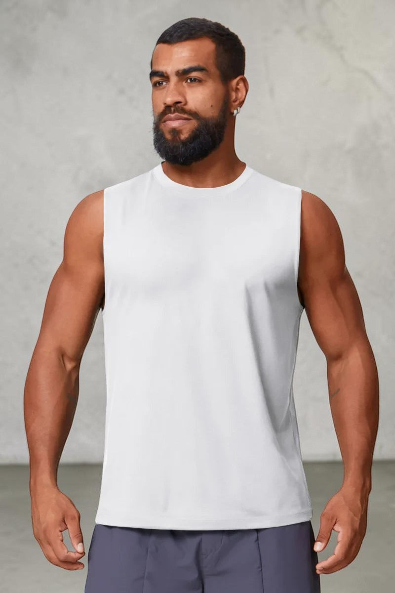 SOLID APPRL white performance tank top on a muscular model, featuring moisture-wicking fabric and a crew neckline.